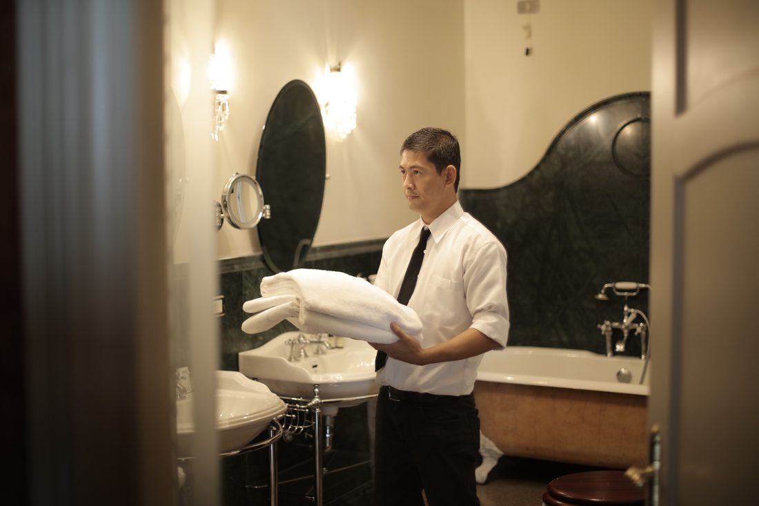 Professional facility staff arranging amenities — facility staffing in Secunderabad